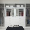 light and airy white walk-in wardrobe