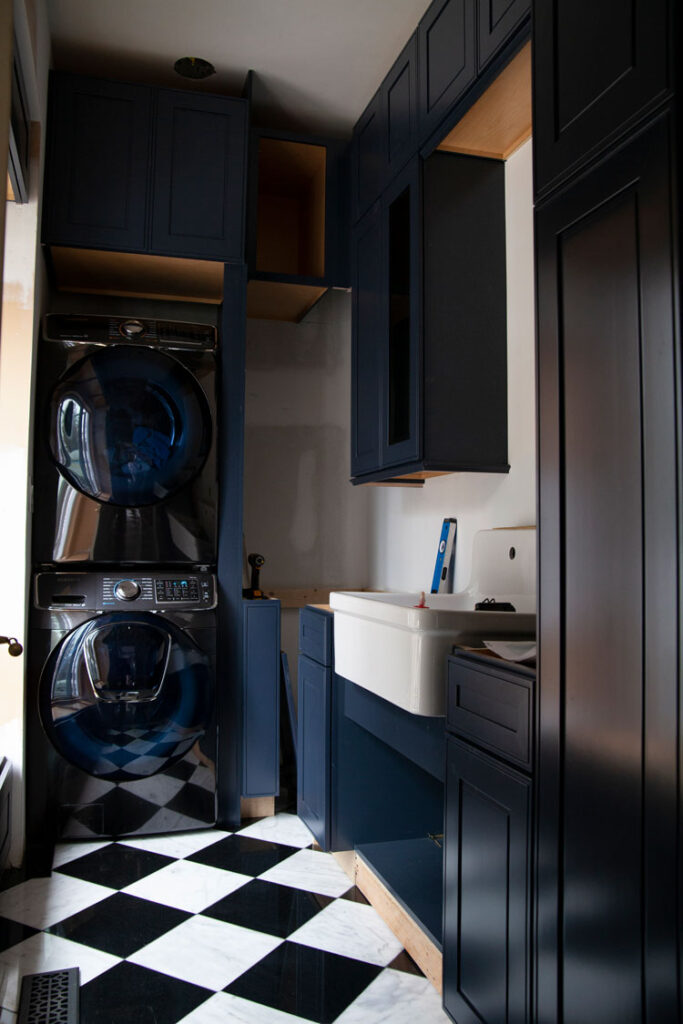 laundry room with windowed cabinets